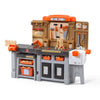 Toy workbench with tools and accessories on a white background